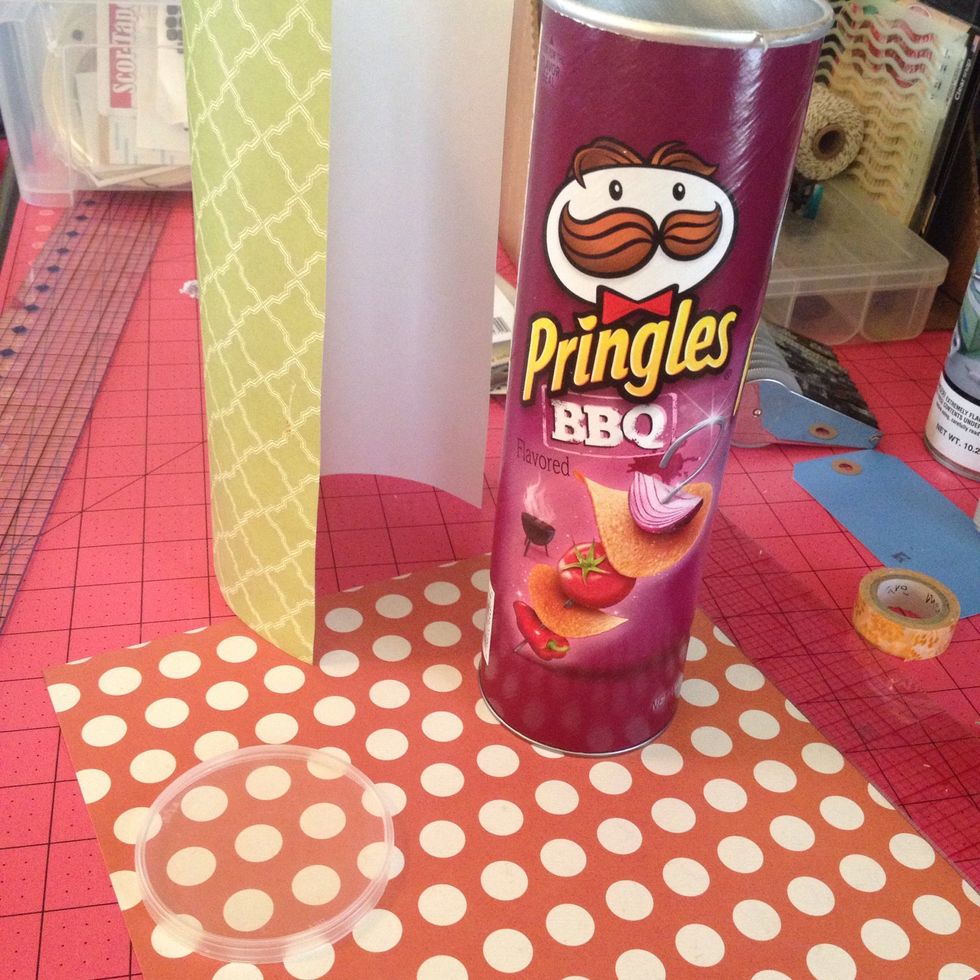 First eat all the Pringles! Wipe out inside container with damp paper towel. Cut a 9.5 inch, x 9.5 inch MINUS 1/8th of an inch. The slightly smaller side will line up vertical
