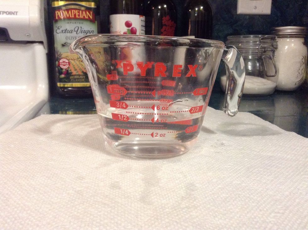 First fill up your measuring cup to 1/2 cup.