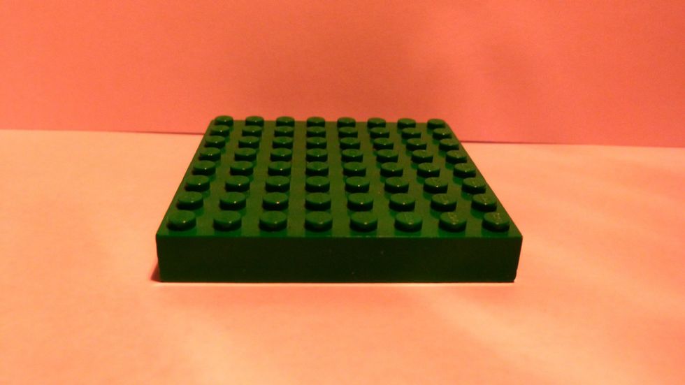 First find an 8x8 thick base plate. (Note that all pieces can be any color).