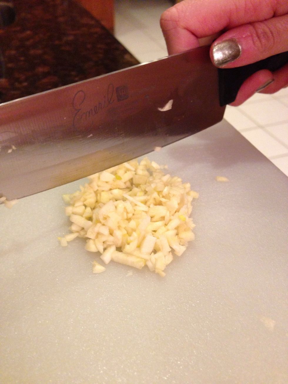 First, finely mince your garlic.