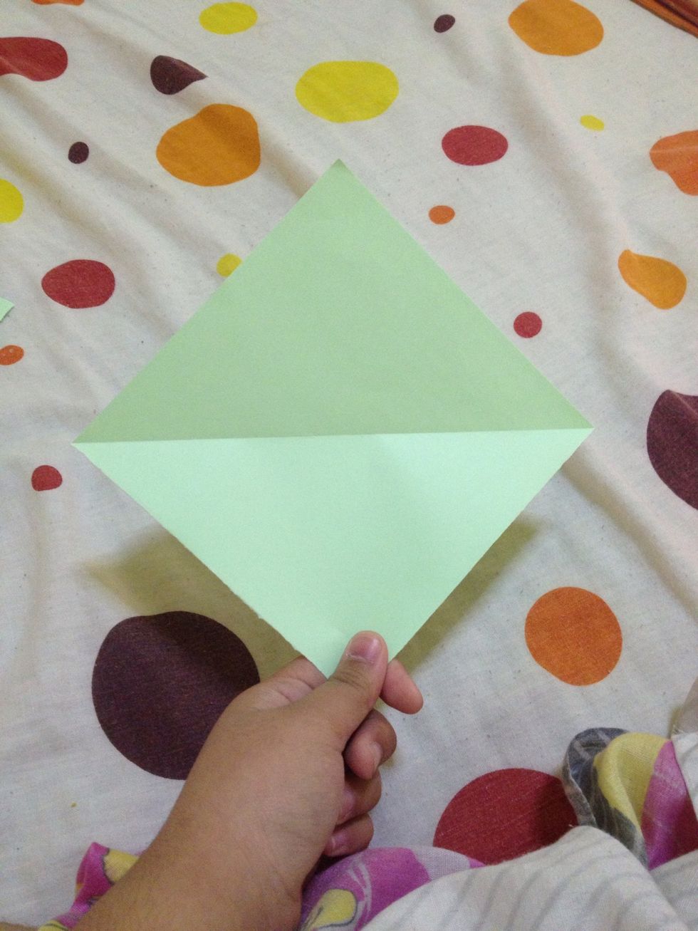 First, fold in half upward.