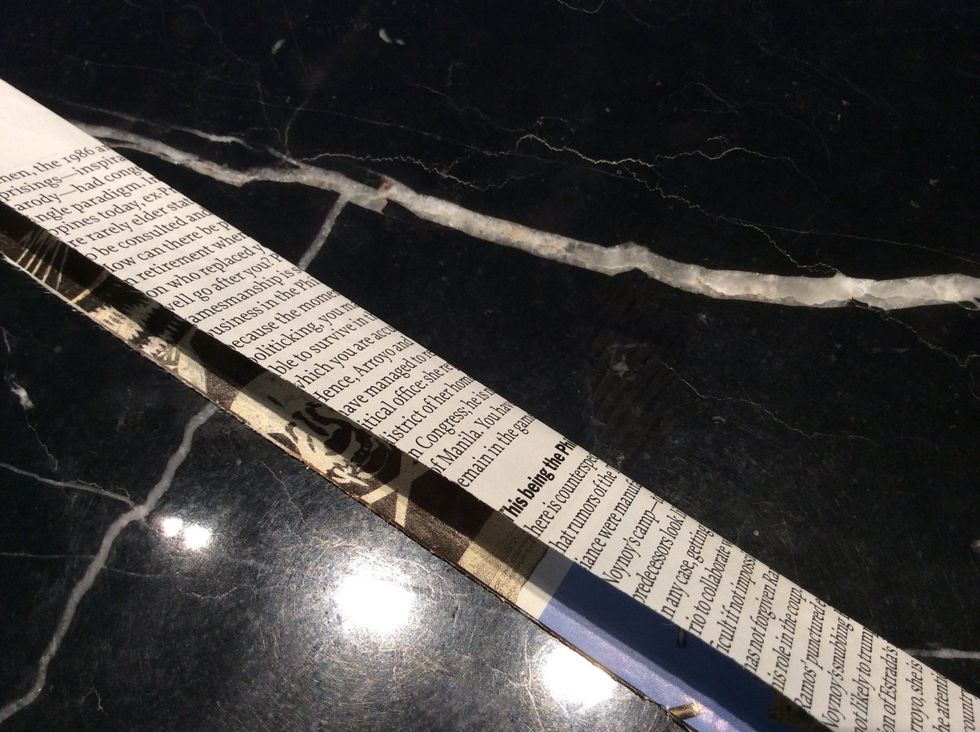 First fold the 2 inch strip in half. Crease it well, you can use a bone folder If you want to but I just use my fingers.