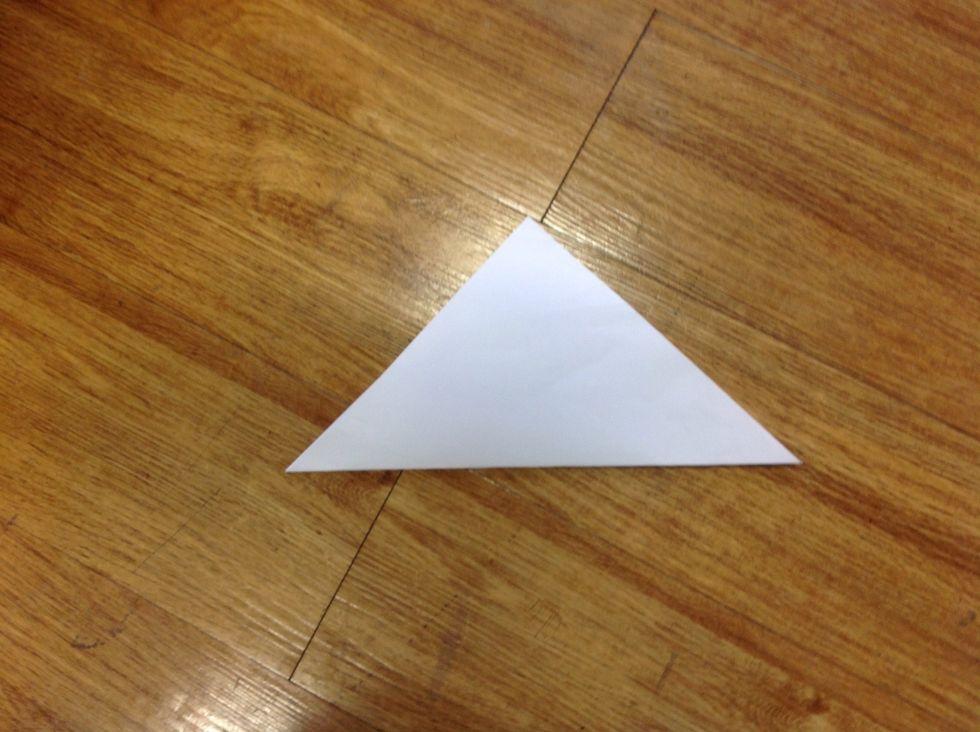 First,fold the squre to a triangle.