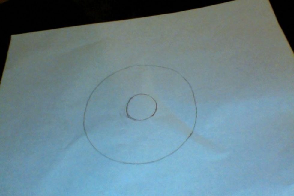 First, for the pattern, you need to draw two circles like this. It helps to trace something circular, but this is optional.