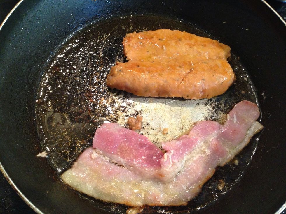 First fry the bacon and sausage in the pan, slice the sausage in half so that it cooks even and gets a crispy bottom preheat your grill to 180\u2022c