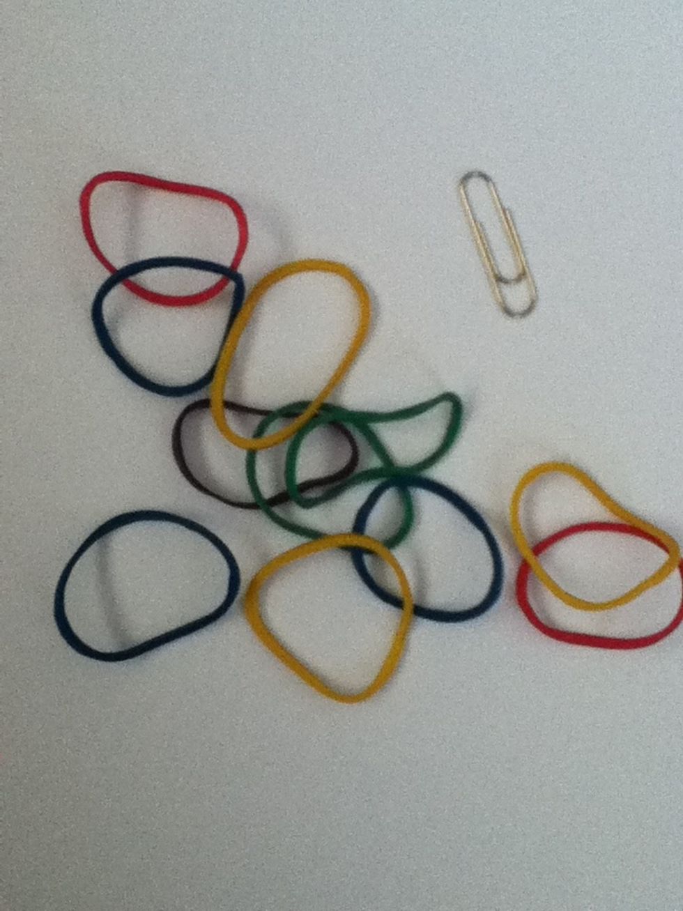 First gather some small colourful rubber bands and a paper clip. Remember that the rubber bands stretch so you might not need a lot depending on the size of your wrist.