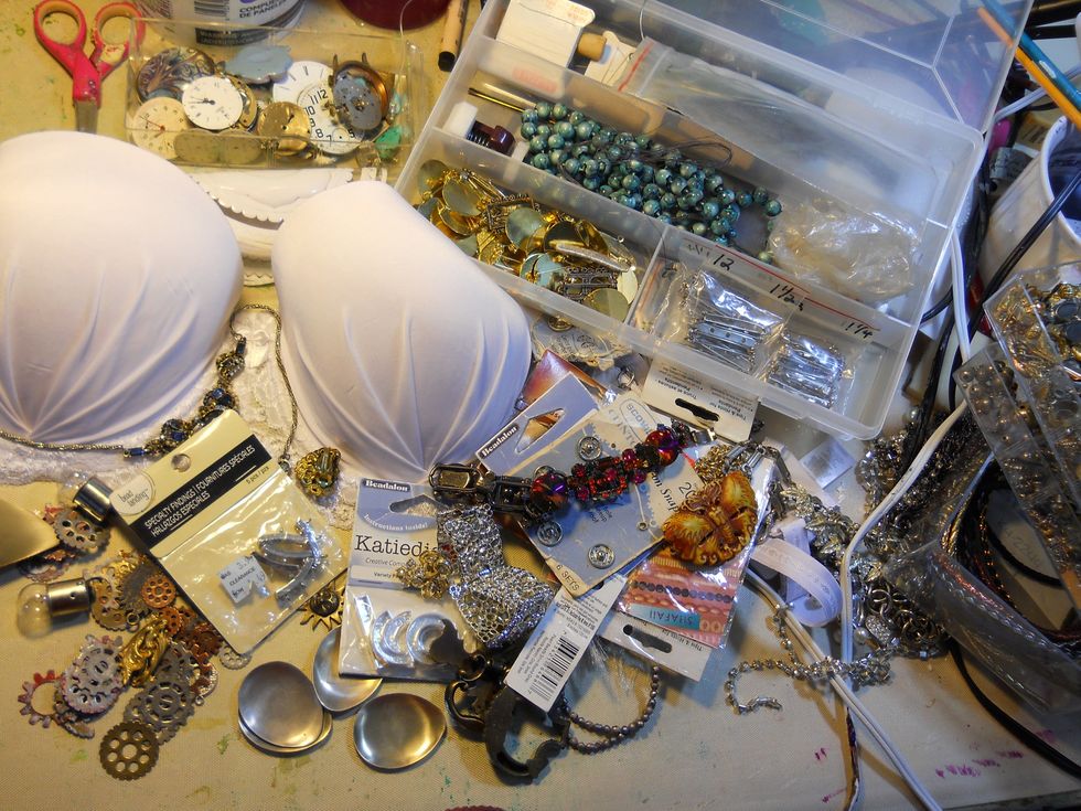 First,gather supplies lol it looks like a mess huh? I wasnt exactly sure which direction I was going when I started so I just got out a bunch of "stuff" like Jewlery findings,ribbon, and metal pieces.