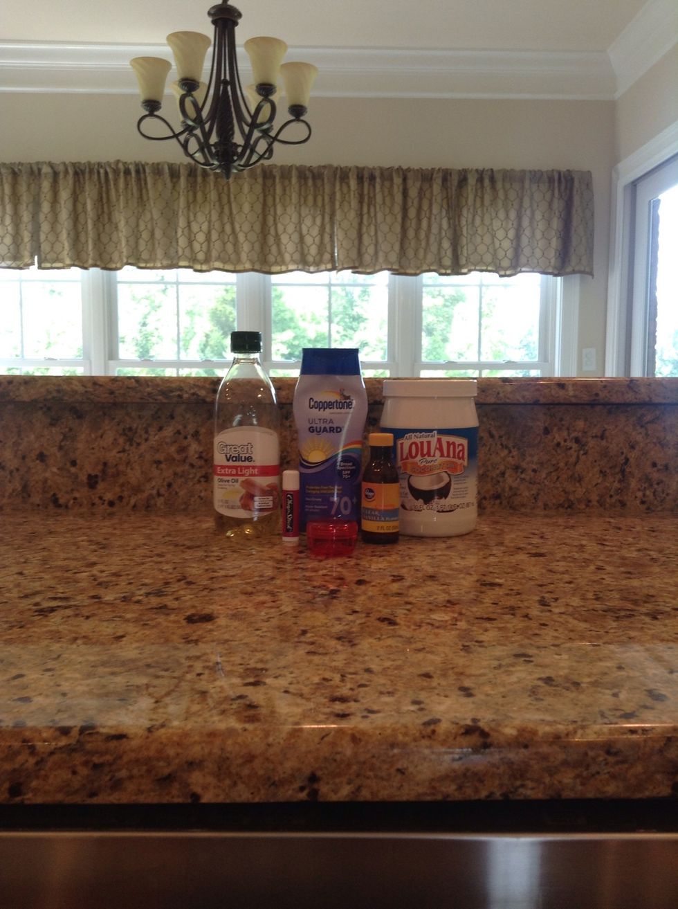 First, gather your supplies. You will need Chapstick, a lip balm container, olive oil, coconut oil, sunscreen, and vanilla extract.