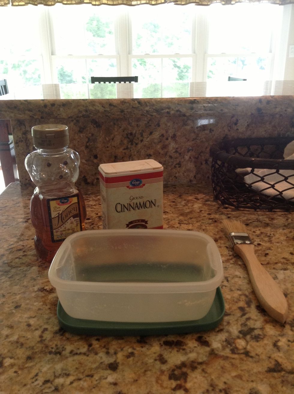 First, gather your supplies. You will need honey, cinnamon, a baster brush, and a small container.