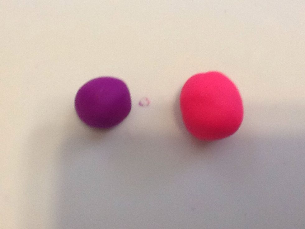 First get 2 or more colors of oven back clay and roll them into a ball