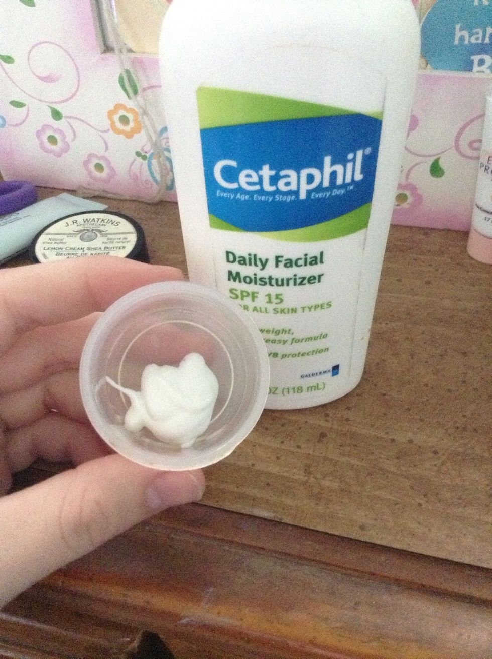 First get a clean container that can be closed. Add a dollop of moisturizer.