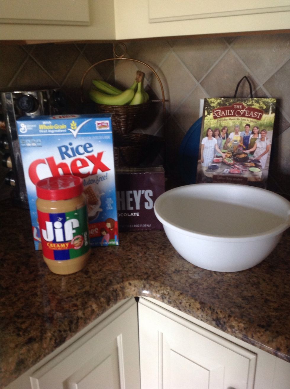 First get a large mixing bowl, peanut butter, chocolate, confection sugar, and Rice Chex.