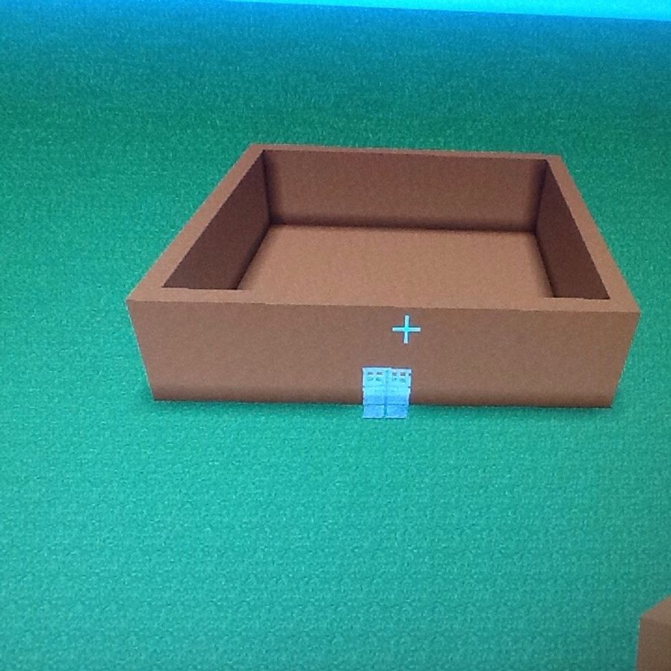 First get any king of block and build 20 by 20 and 5 high. Place doors on any side. Brake the floor and place any block down.