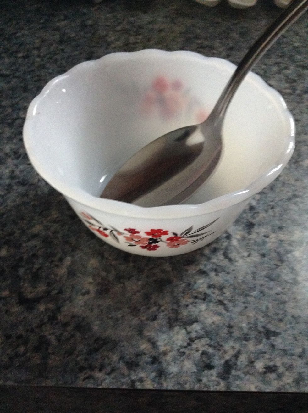 First, grab a bowl and a spoon to mix the ingredients.