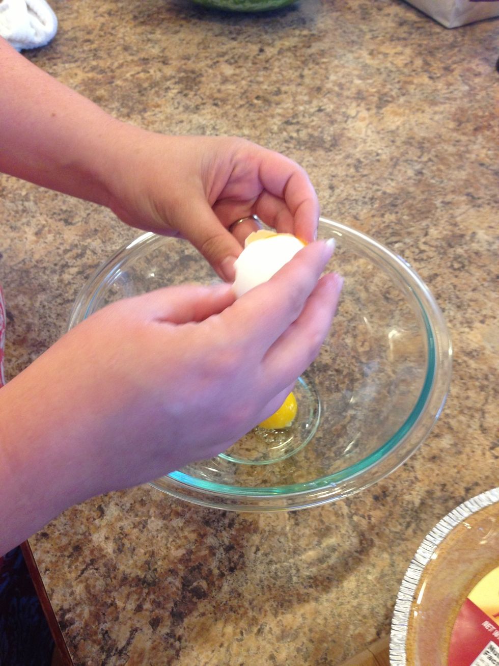 First grab a medium size mixing bowl and 1 small bowl to separate the yolks from the whites. Be careful not to break the yolk. ( it's easier to separate if the yolk stays whole)