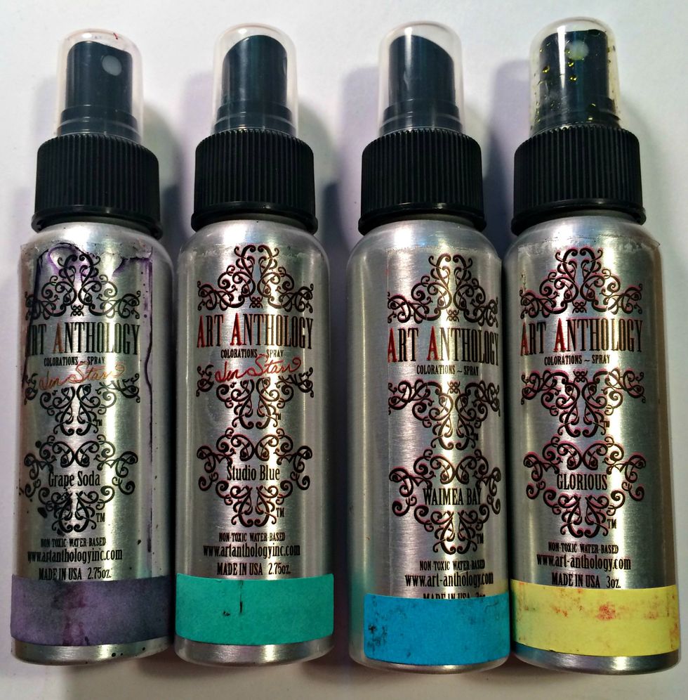 First grab your Art Anthology Colorations Sprays in Grape Soda, Studio Blue, Waimea Bay, and Glorious. Then grab a piece of white cardstock.