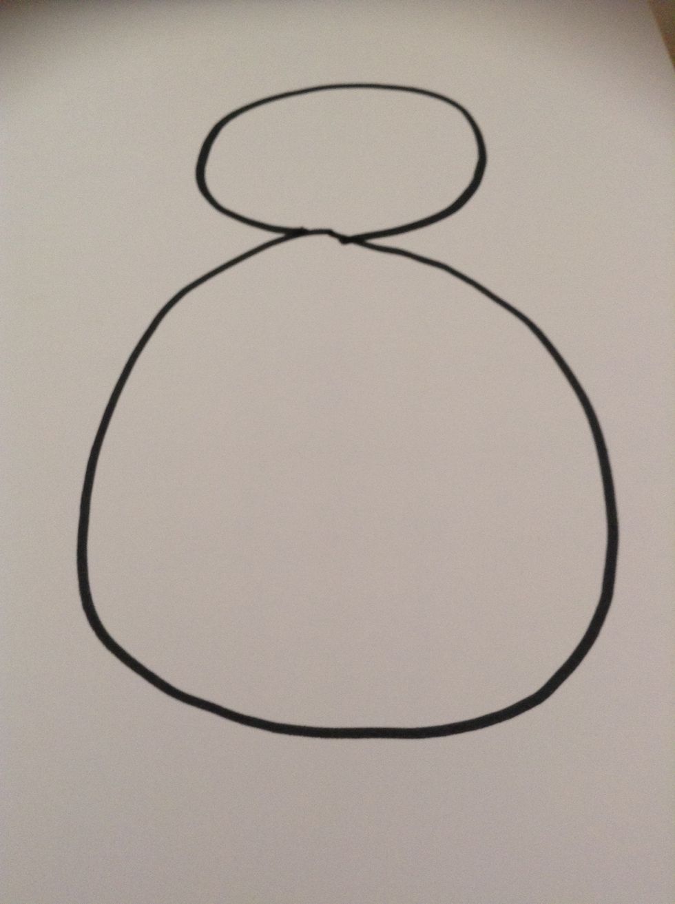 First, grab your black marker and draw a circle for the body and an oval for the head.