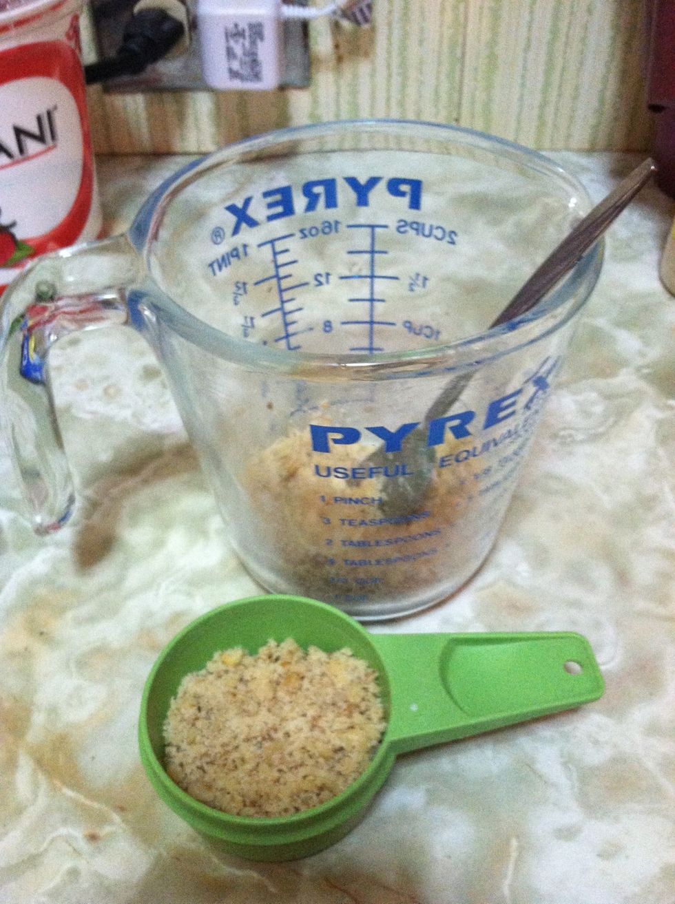 First, grind up the walnuts. I used this pyrex measuring cup and the thick wooden handle of a spoon as a makeshift mortar & pestle. Electric grinders work fine as well of course.