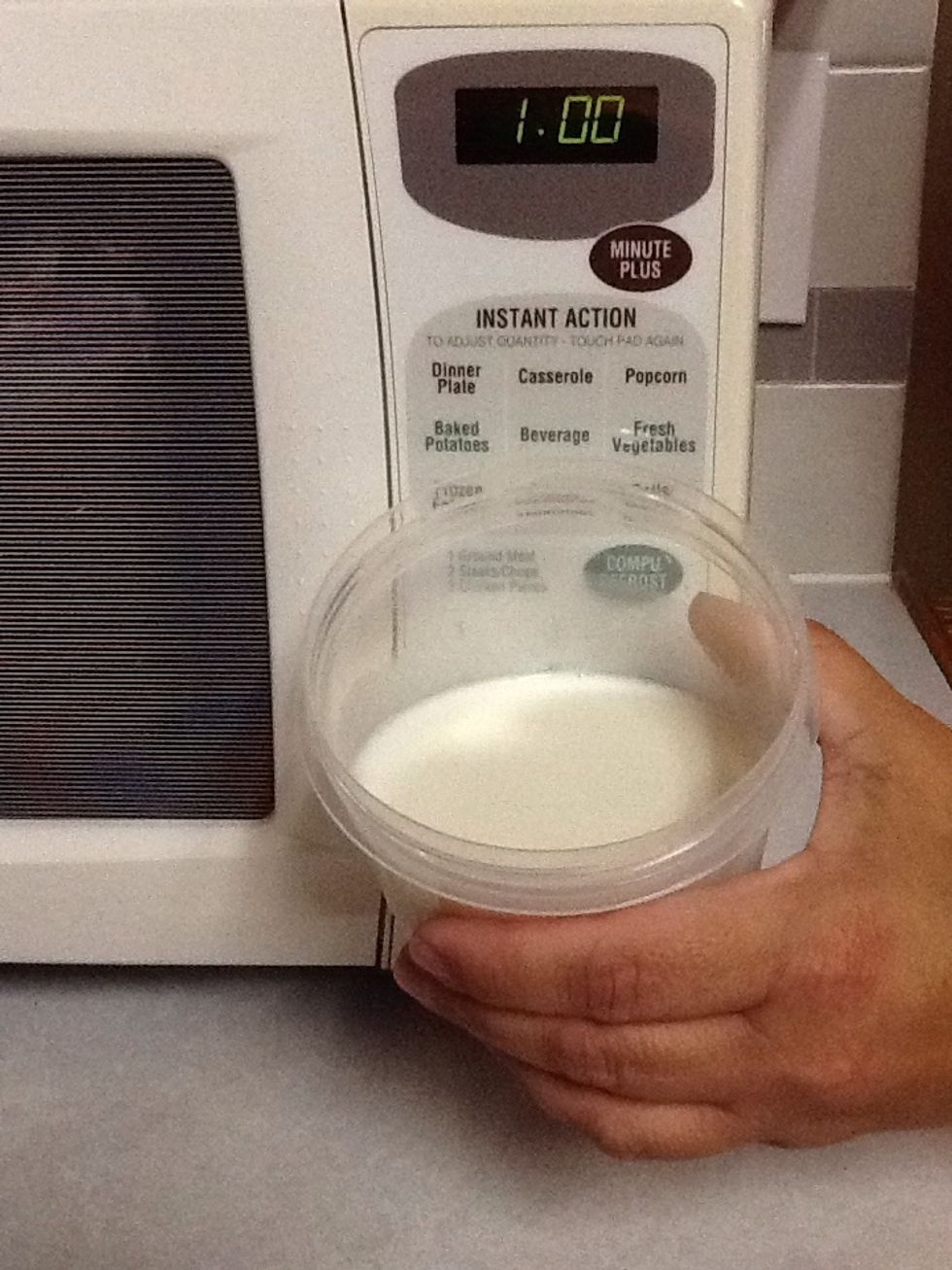 First, heat a cup of milk for 1 minute.