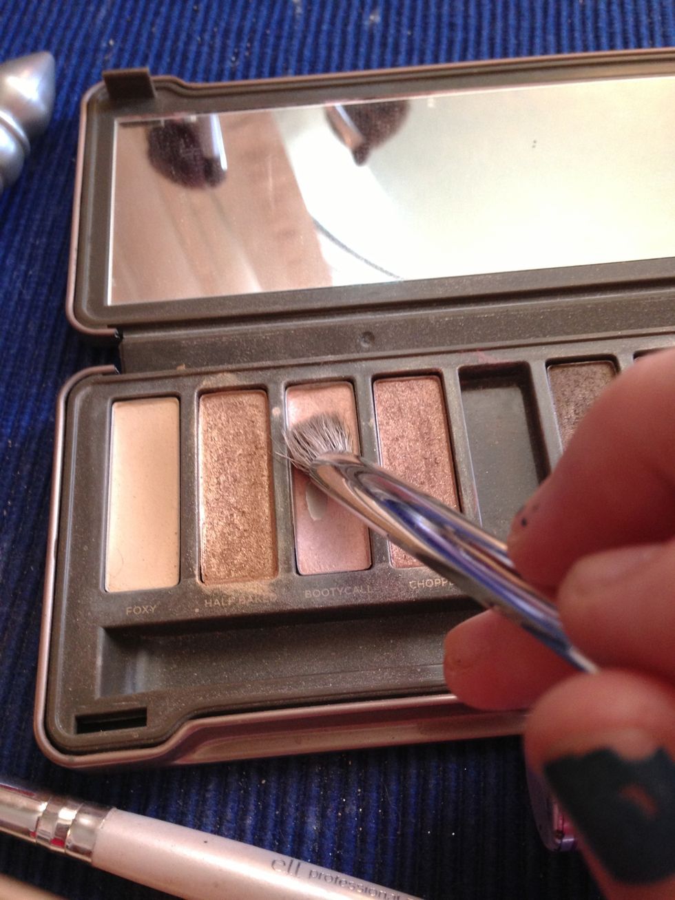 First, I apply a light shimmer all over my lid.