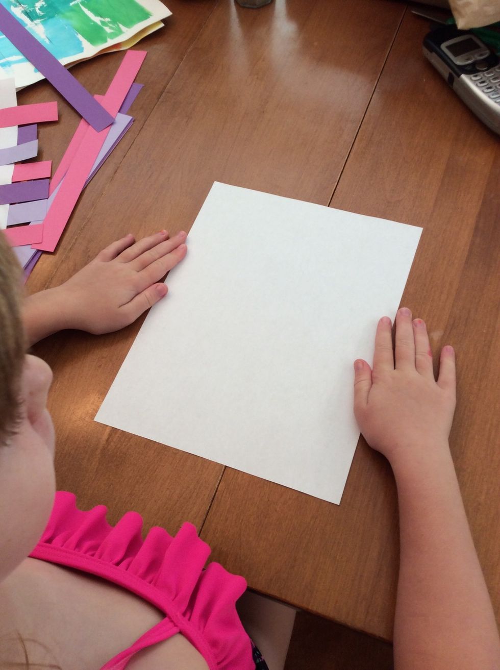 First I hold my paper the TALL way.