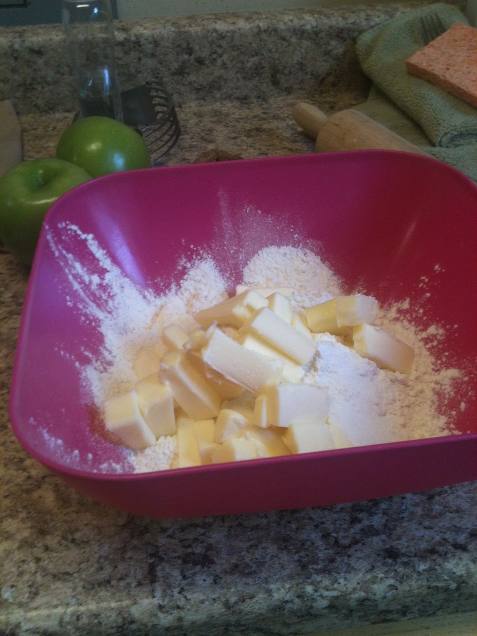 First I make the crust. I put 2.5 cups or flour, 1 teaspoon of salt, 1teaspoon of sugar, 2 sticks of butter into a bowl.