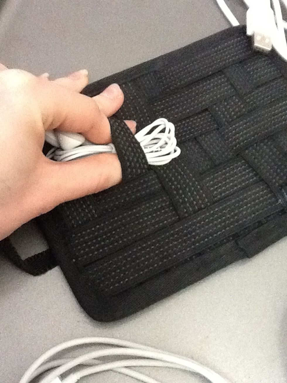 First, I put the small items in, finding a length of band that fits the width of the item.