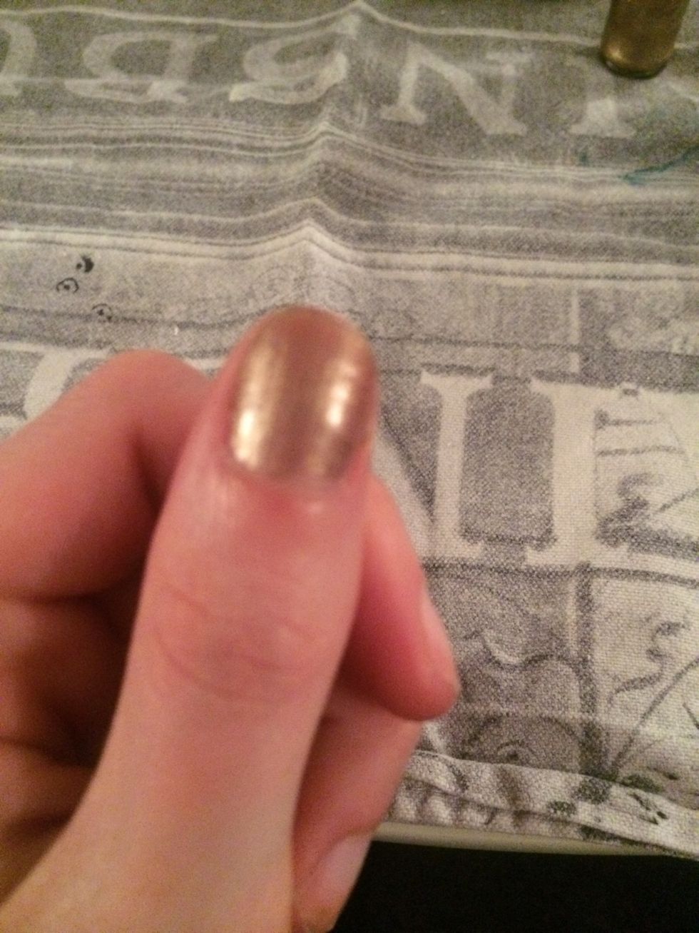 First I used gold nail varnish as the base coat for my nails.