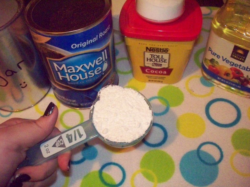 First ingredient! We're going to put a 1/4 cup flour (I'm using all purpose) into the mug.