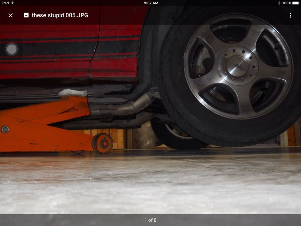 First jack up the tire you want to take off