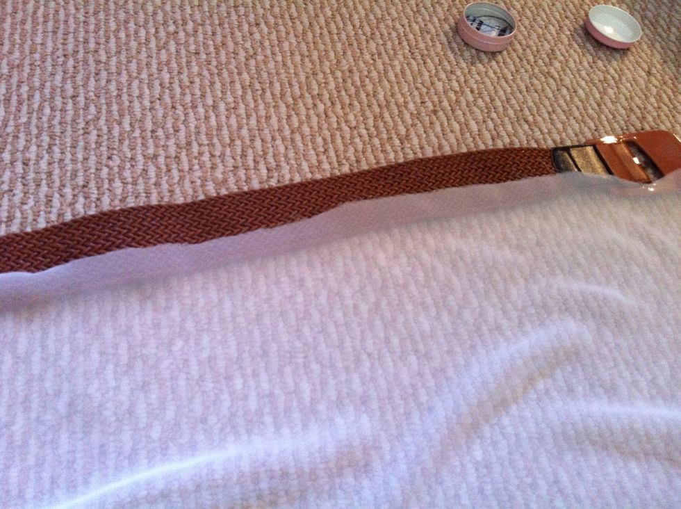 First, lay the fabric on the belt to measure the width (just a little bit longer than the belt on both sides)