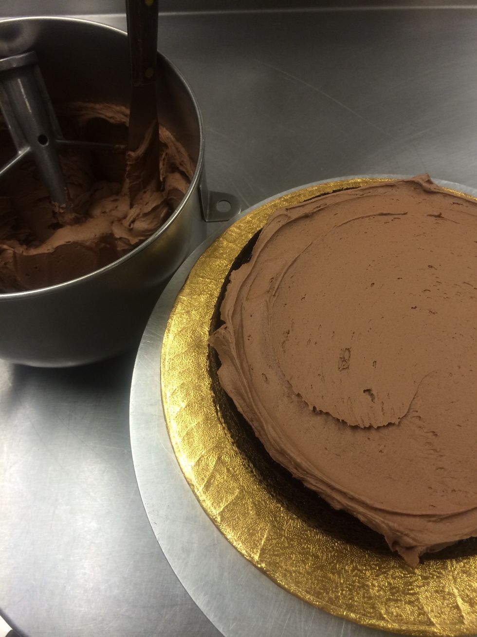 First layer of frosting is on between the first layers.