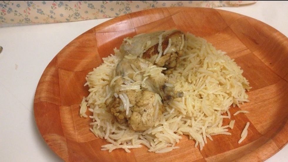 First layer should be rice, second chicken, third rice and last one carrots and raisins.