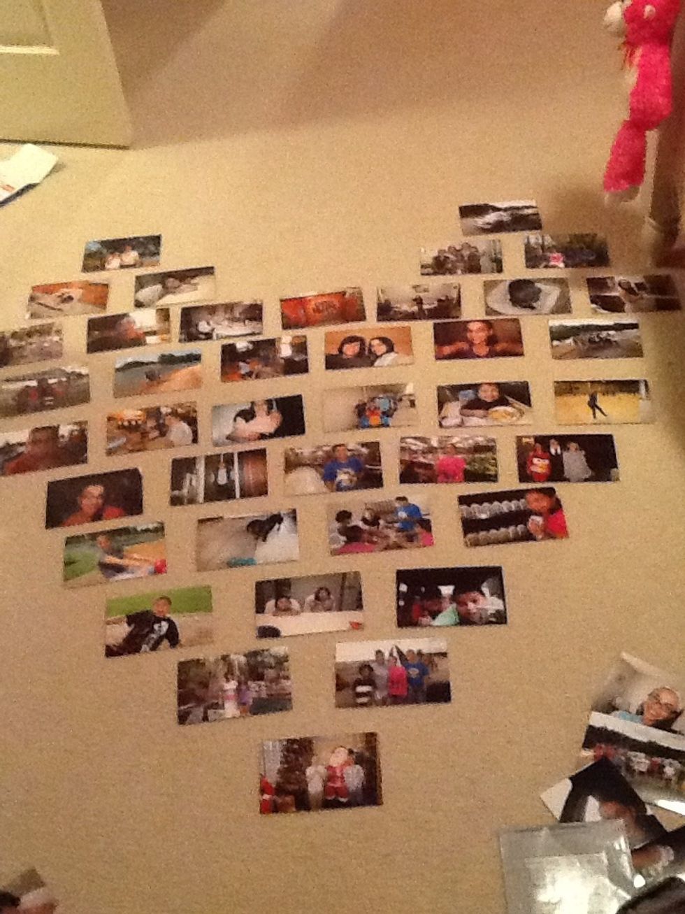 First layout the pictures in the shape of a heart.This will make it easier so you know where to place the photos on the wall. (You can try other shapes besides a heart.)