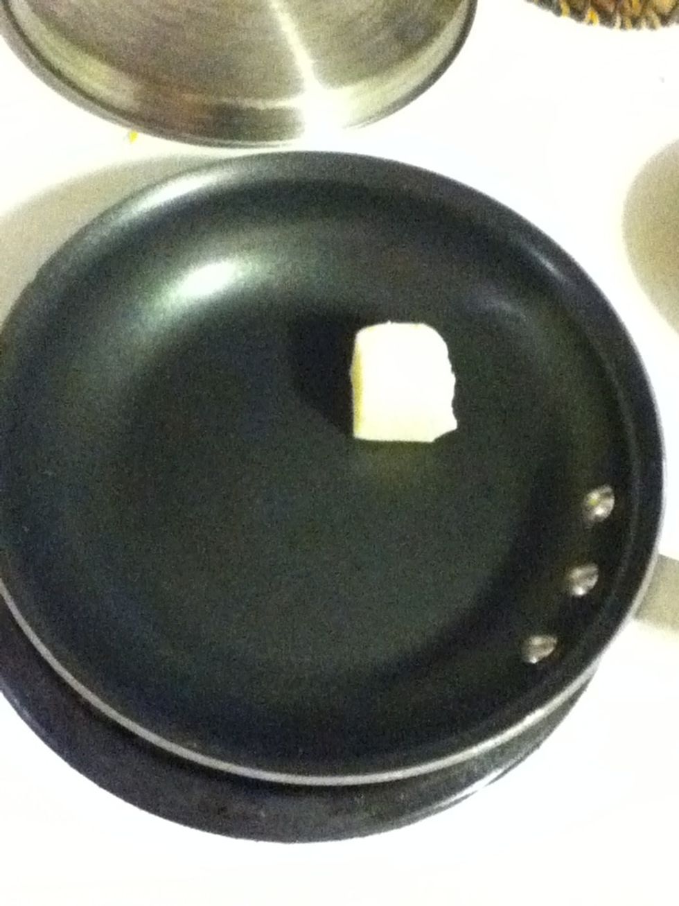 First let's make a killer date and onion chutney. Put a couple pats of butter on medium high in a nonstick pan.