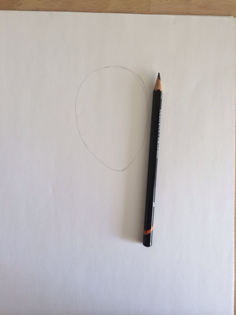 First, lightly draw an upside down egg...