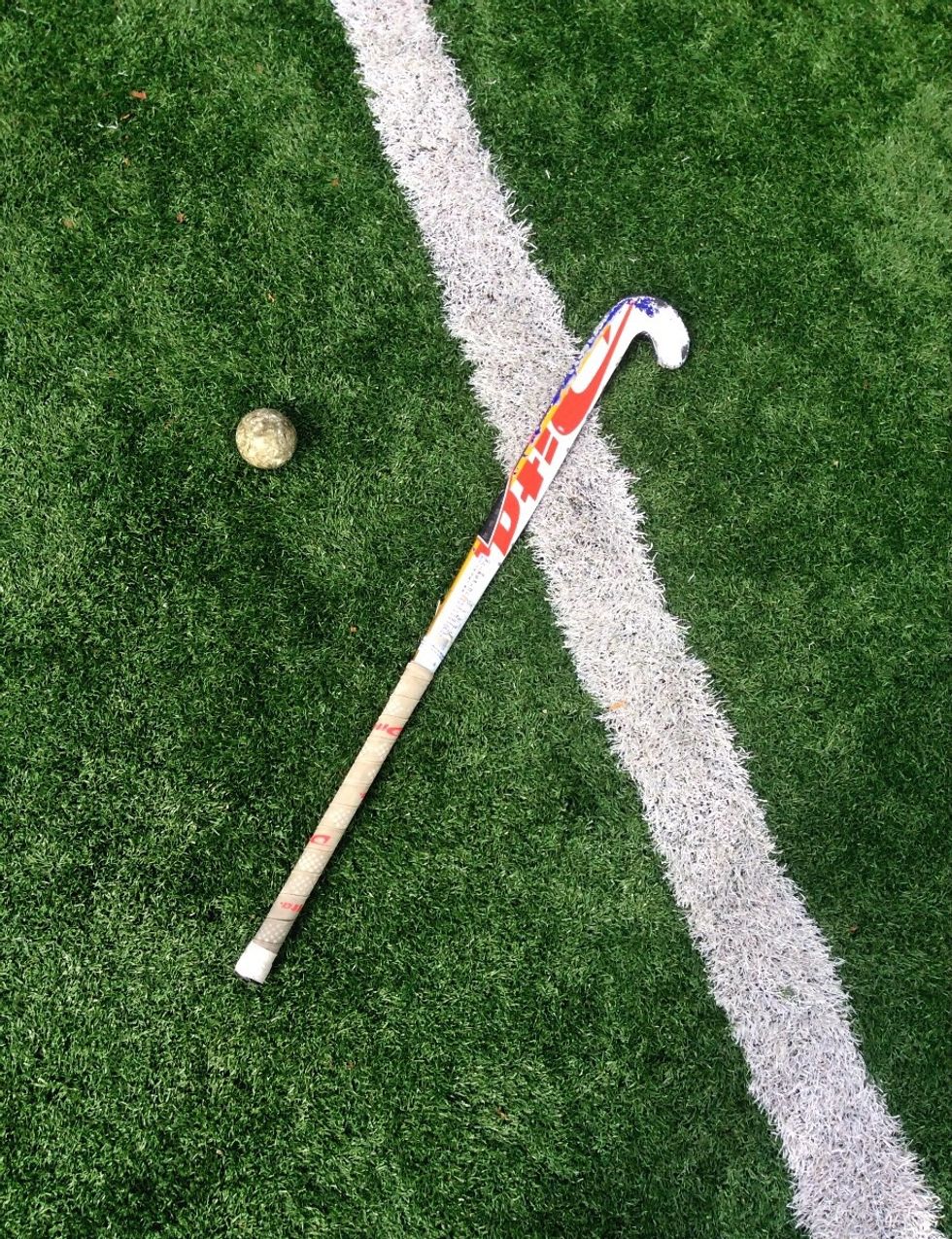 First make sure you have an appropriate size field hockey stick and a field hockey ball.