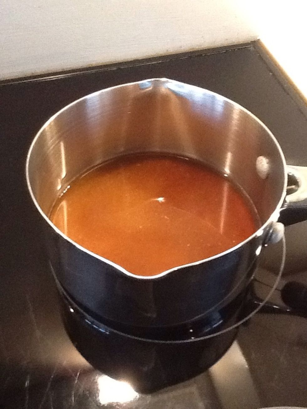 First make the caramel for the icing. Put the granulated sugar in a small pan with 3tbsp water.