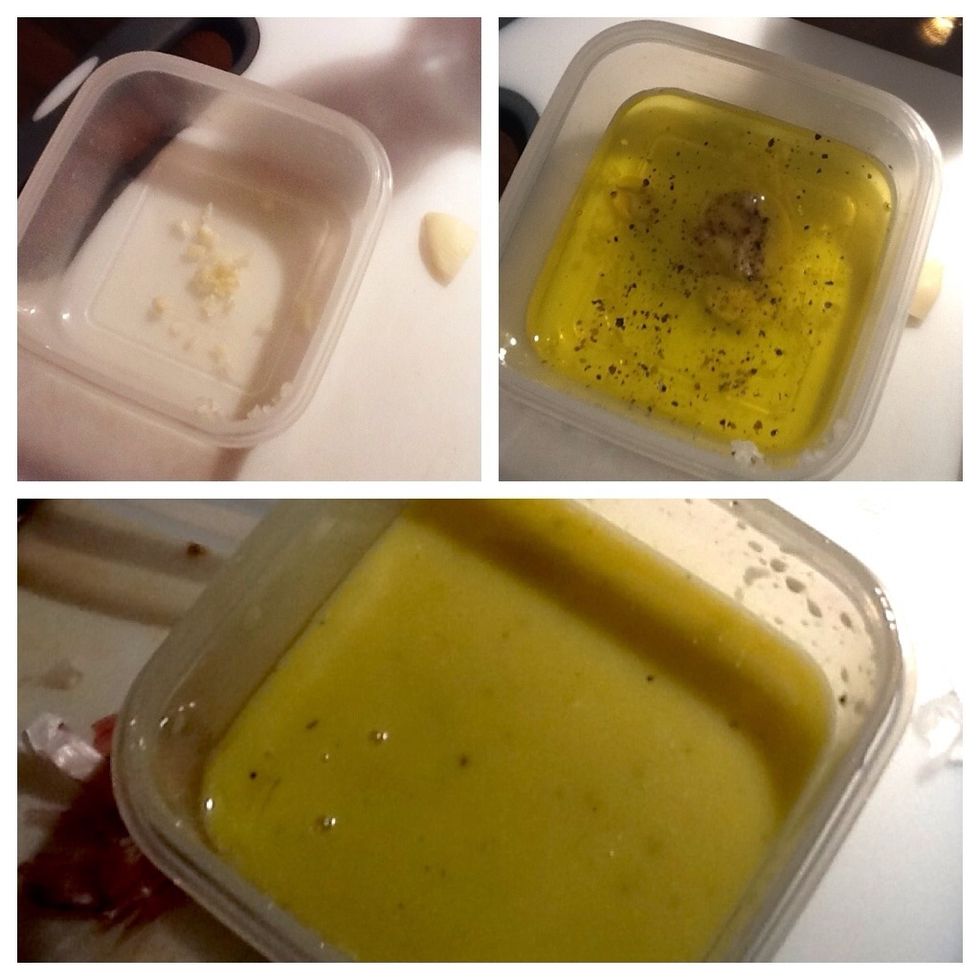 First make the dressing. Add garlic, olive oil, vinegar, mustard and salt and pepper (to taste) to a small tupperware or jar with lid. Close the container and shake, shake, shake until it's all mixed!