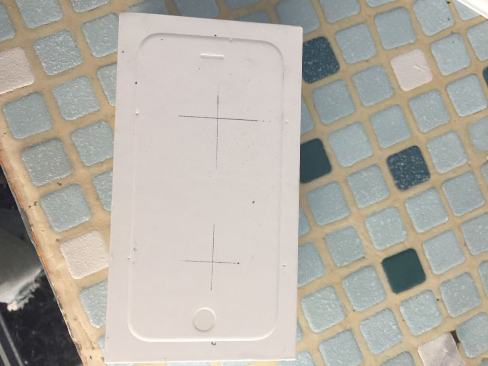 First mark the center of the eye holes. These will obviously be positioned so they center with the two halves of the VR screen and your eyes.