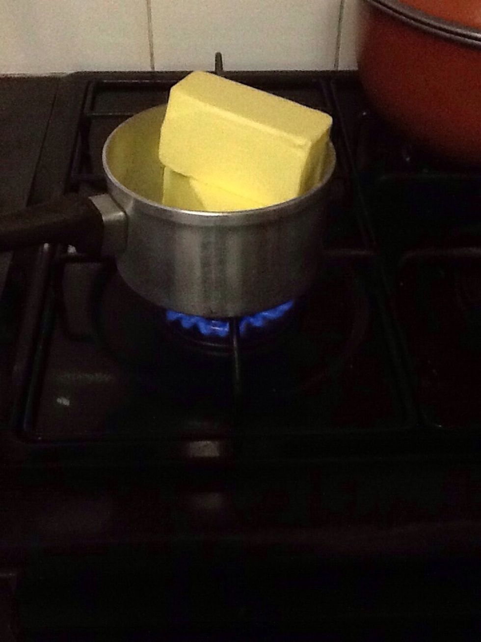 First melt a block and a half of unsalted butter in a pot and preheat the oven to 280 degrees