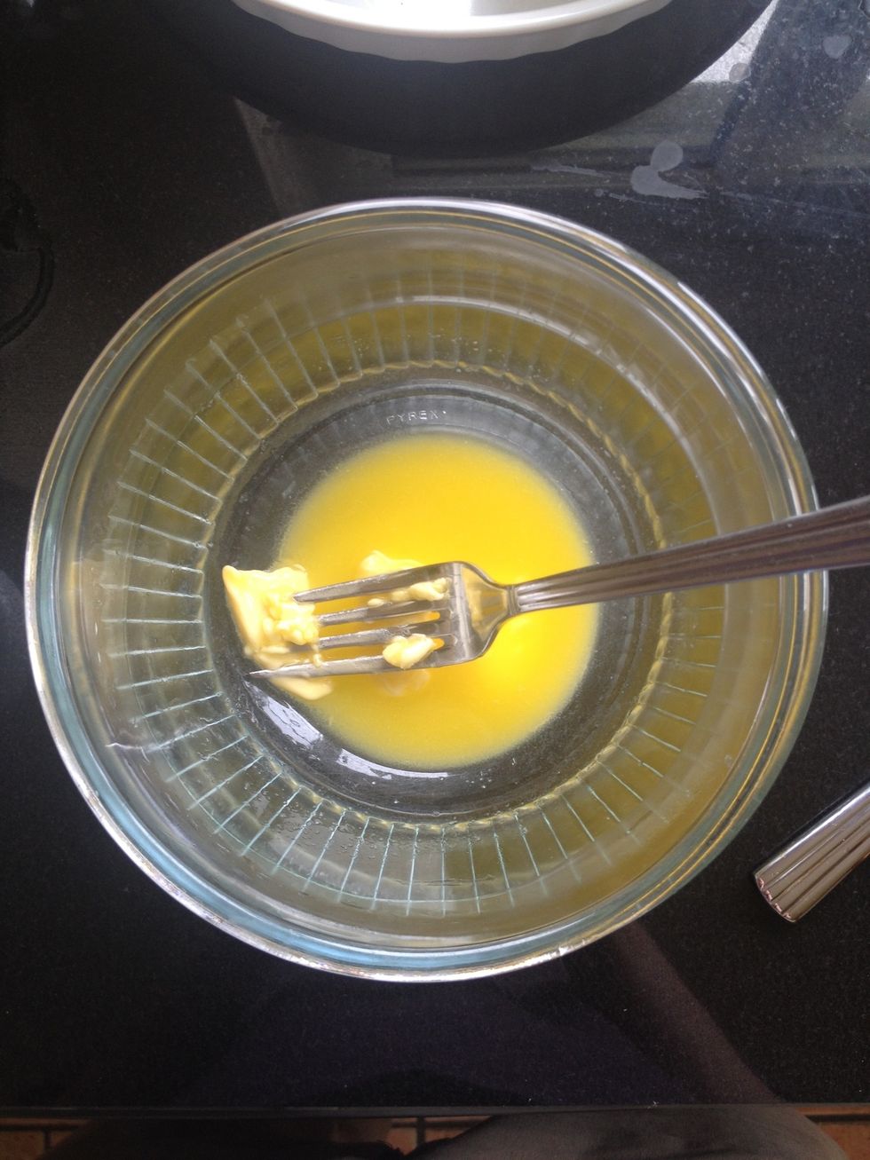 First melt the butter over some boiling water.