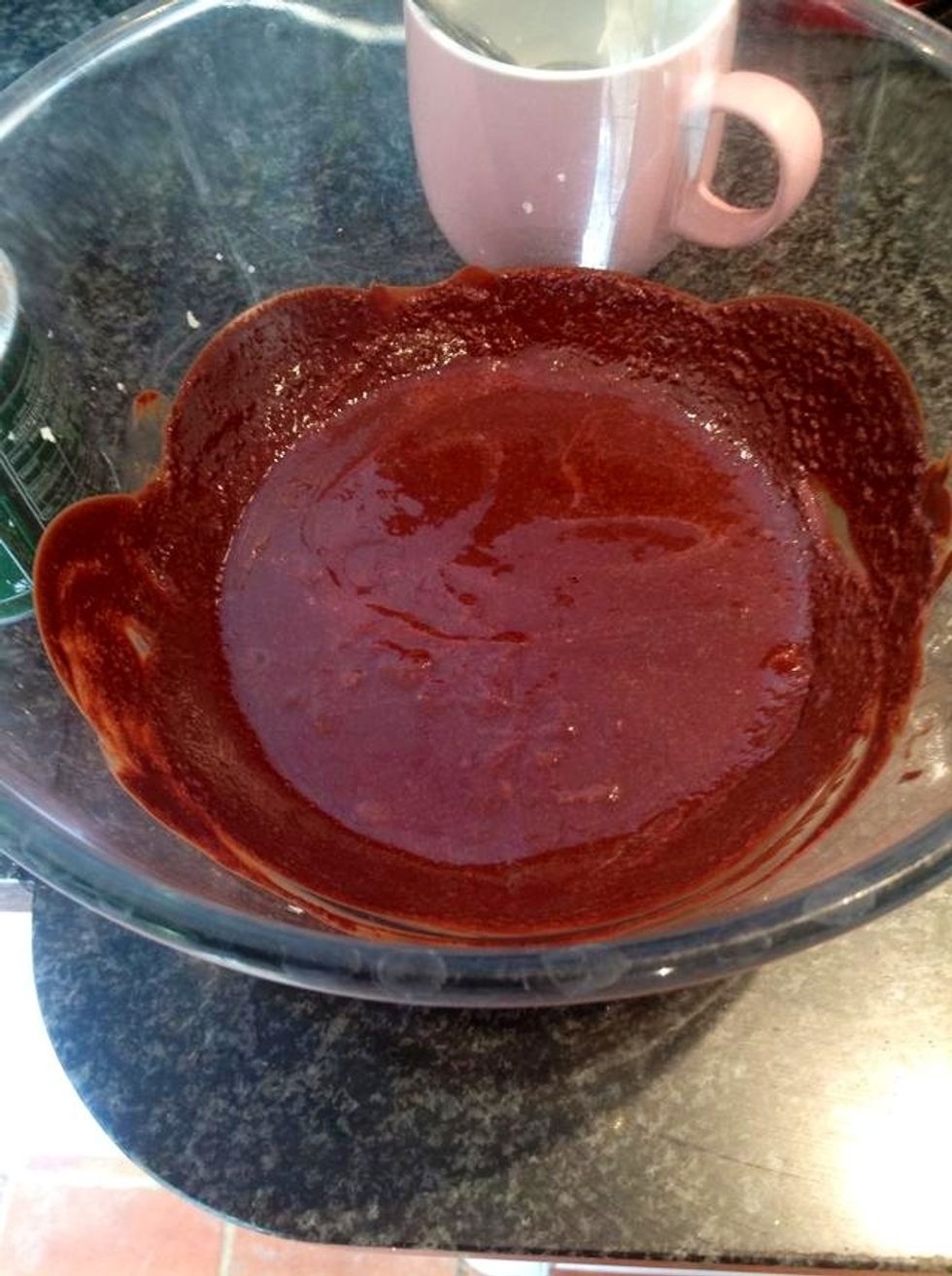 First melt the chocolate and butter gently over a pan of boing water (make sure bowl does NOT touch chocolate) or do quick gentile bursts in the microwave. Then let the mixture cool.