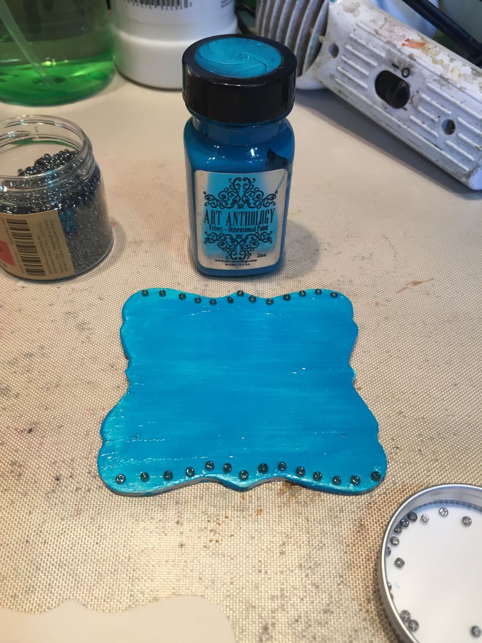 First, mix Fifi, Tango, and Mardis Gras with glue. I used four parts paint to one part glue since my beads had some weight.