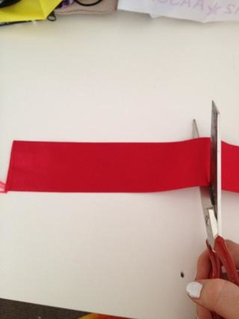 First, Obtain your ribbon and cut it any length you want.The bigger the length, the bigger the cheer Bow!