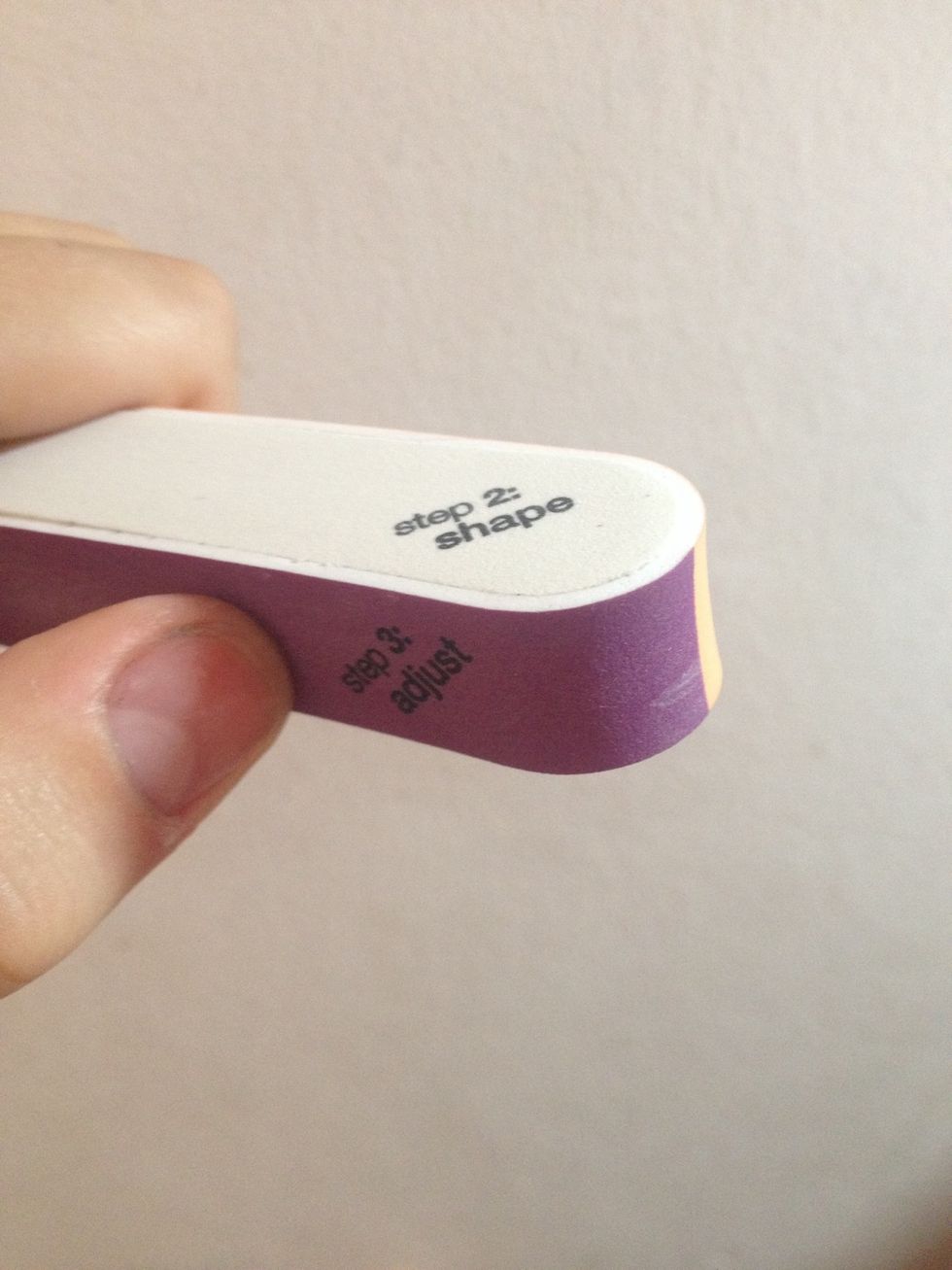 First of all, clean and file your nails until they look good again :)