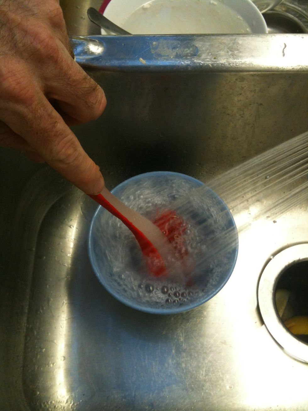 First of all rinse off all the food particles.