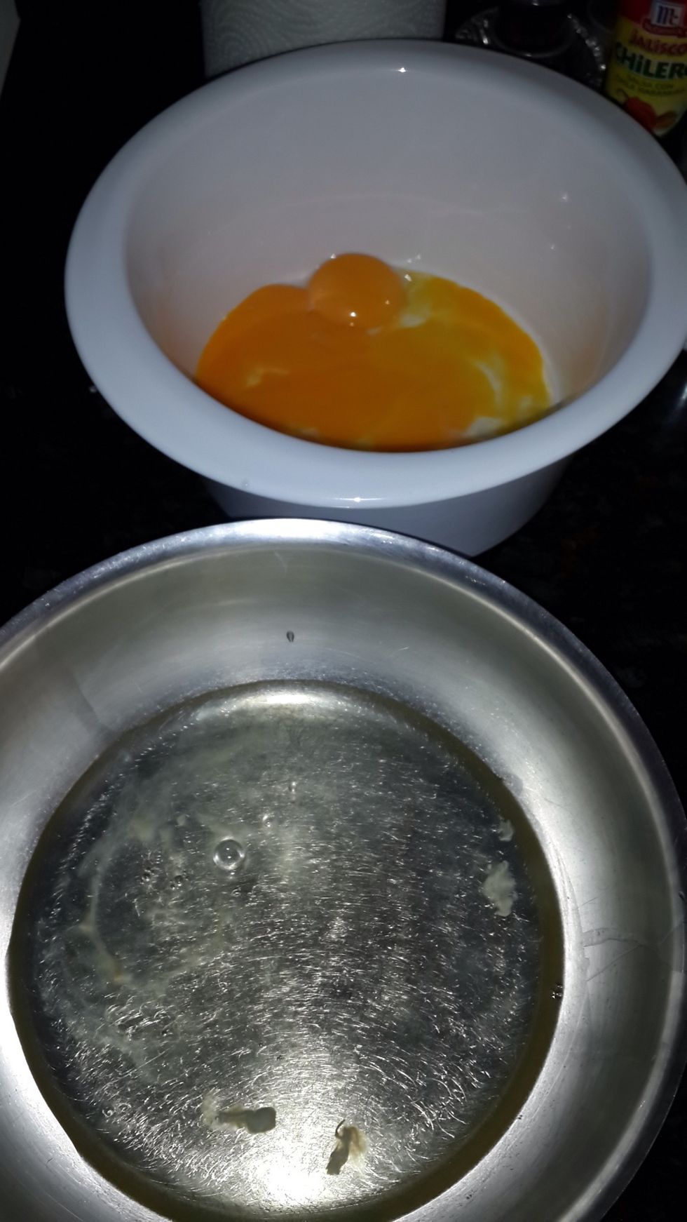 First of all, the most important step, separate the yolks and the whites of all the eggs. Make sure that the whites don't get even a bit of yolk, do your best!!