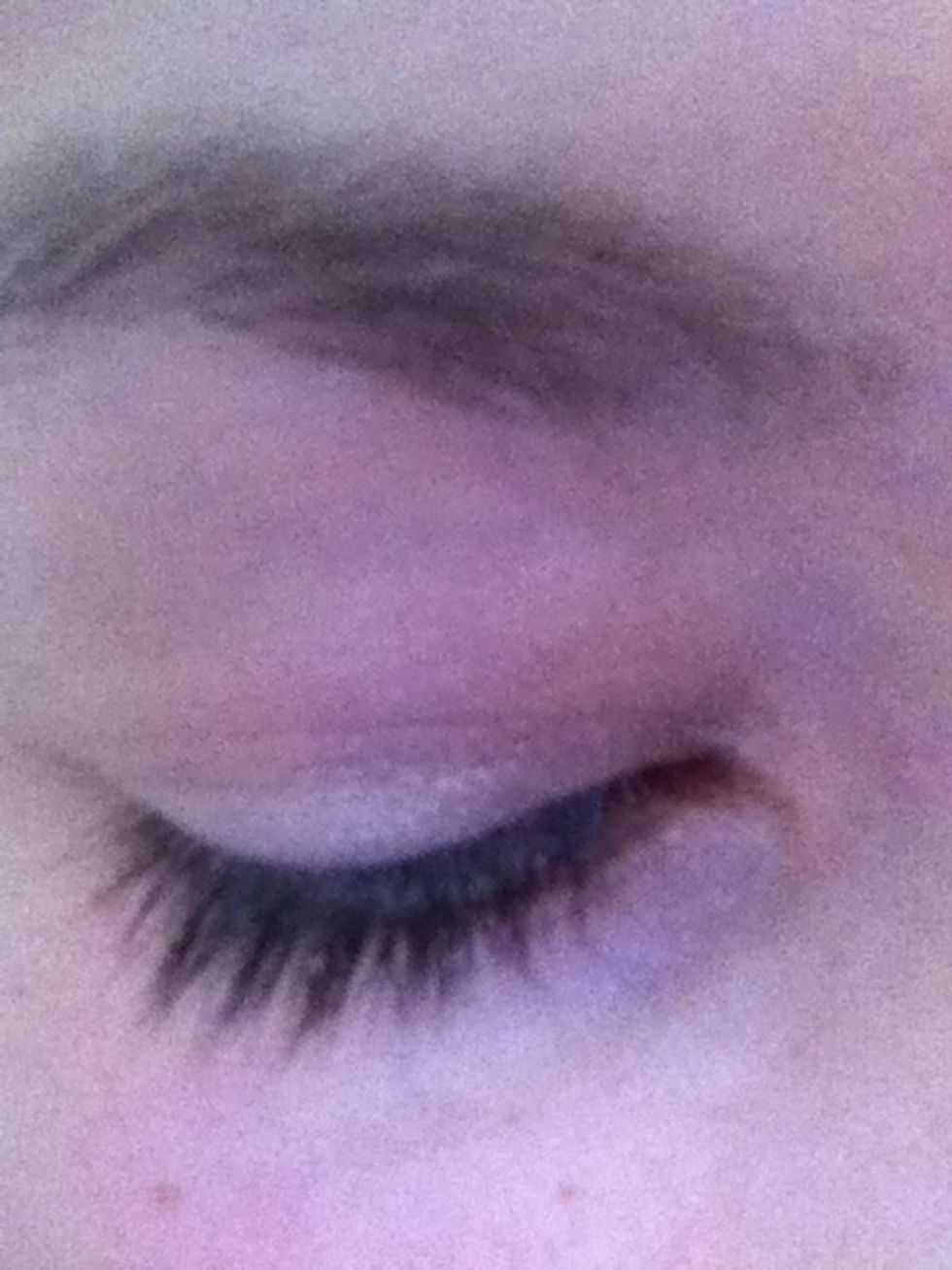 First of all, use a primer on your eyelid and brush on a light layer of beige eyeshadow.