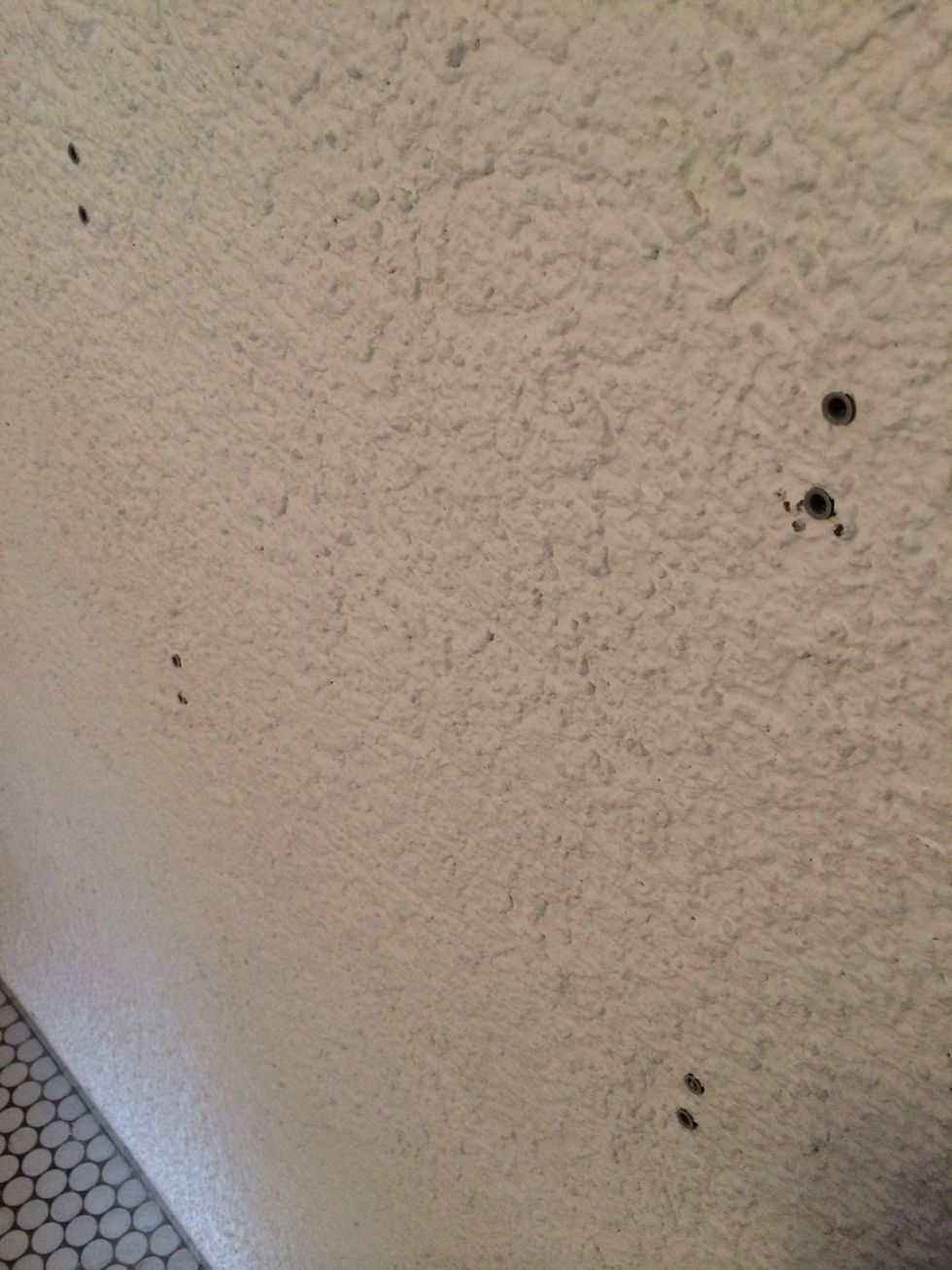 First of all you need to drill holes, two for each hook.